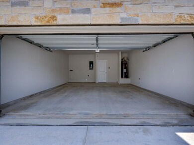 Garage with water heater and electric panel