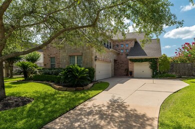 Long driveway leads to the 3 car garage