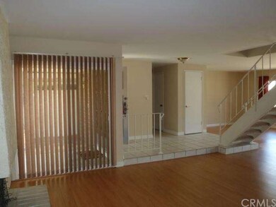Living room to foyer and stairs.