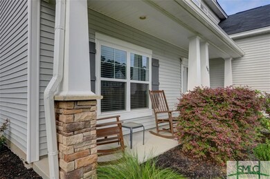 Inviting front porch complete with rocking chairs 