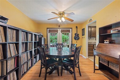 The cheerful dining area features hardwood floorin