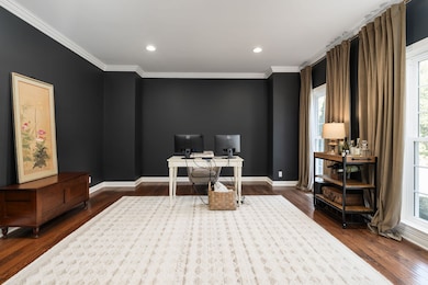 Dedicated home office space on the main level offers a spacious and sophisticated work-from-home option.