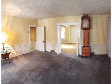 Living Room has wainscoting surrounding the room