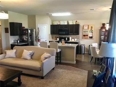 Living room featuring dark wood finished floors