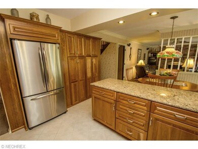 Stainless Steele Appliances Stay with Neutral Tile