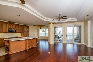 The living space is a sweeping, wide room with Bra