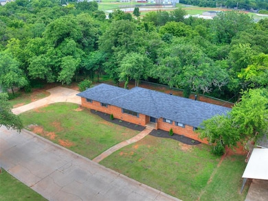The home is full of renovations including a brand new roof in 2025.  The elongated side driveway leading to the 2 car garage provides ample parking options.  Note the .62 acre wooded lot, a rare find!