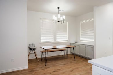 Dining room featuring light wood finished floors, 