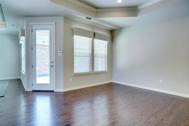 Dining area looking out at covered patio and court
