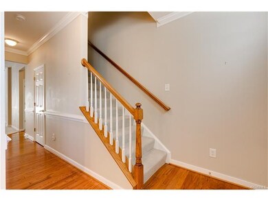 Stairs to second floor.  Half Bath door in the hal
