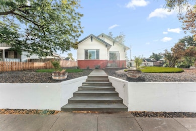 Bungalow-style house with brick siding