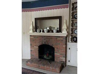 Exterior Front. Lovely Gas Fireplace w/ Built in B