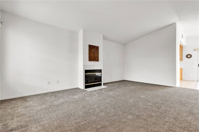 Unfurnished living room featuring light colored ca