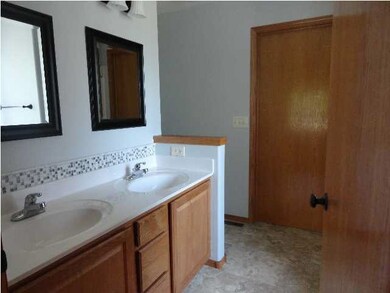 Walk in closet at end with soaker tub and shower a