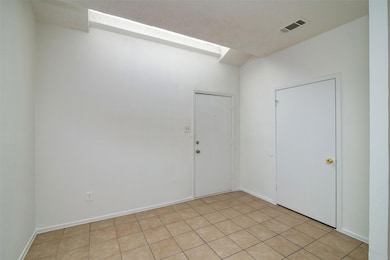 Spare room featuring baseboards and visible vents