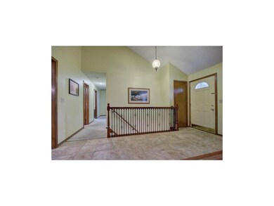 Updated spacious entryway with ceramic tile floori