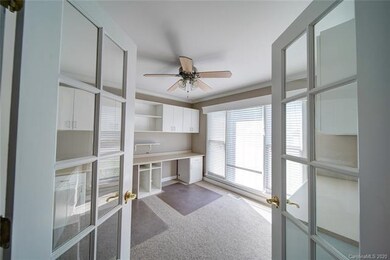 The spacious Office just off the foyer features a 