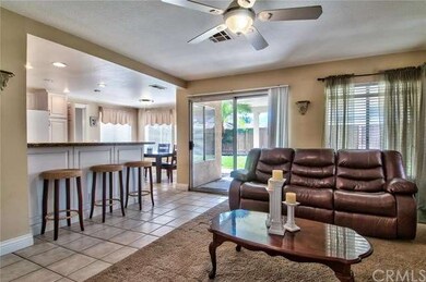 Overlooking the kitchen and featuring a warming pl