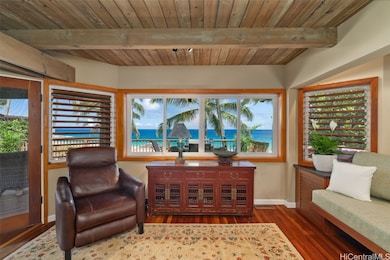 Living room view of the panoramic turquoise ocean.