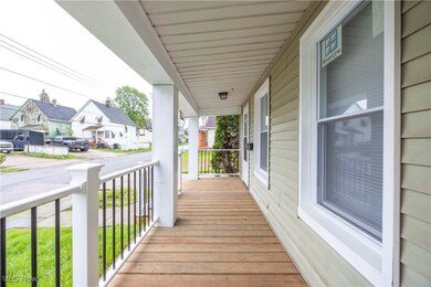 Wooden porch featuring a residential view