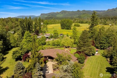 Outbuildings, barn, and greenhouse add space for animals, gardening, equestrian pursuits, or business ideas—imagine a wellness retreat, Airbnb, or wedding venue.