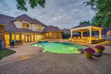 A stunning backyard oasis comes alive at night with beautiful LED lighting for your entertaining delight!