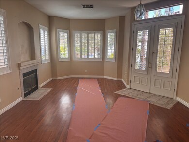 Entryway with french doors, dark wood-type floorin
