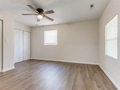 Unfurnished bedroom featuring a closet, ceiling fa