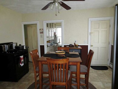 Kitchen. Chair rail, gas stove & pantry off kitche