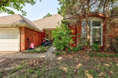 View of side of home featuring a garage