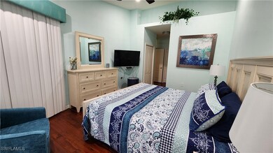 Bedroom with dark wood-style floors