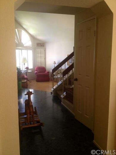 Entry way has large closet that extends through to dining room.