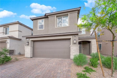 Traditional-style house with decorative driveway,