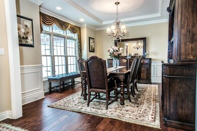 Gorgeous Dining Room with wainscoting, crown moldi