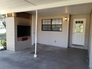 Covered carport with built in grill area