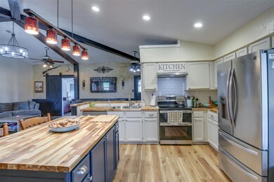 Kitchen featuring stainless steel appliances, whit
