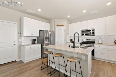 KITCHEN WITH COFFEE BAR AND PANTRY