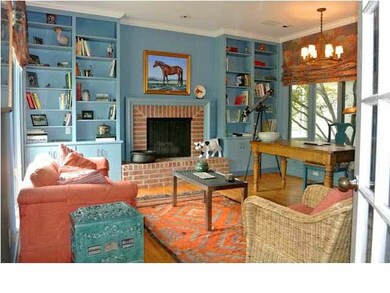 HOME OFFICE WITH BUILT-IN BOOKCASES AND 2ND FIREPL