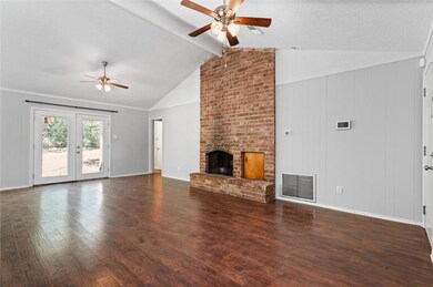 Unfurnished living room featuring visible vents, a