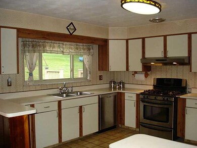 Kitchen. The kitchen is large and has an extra wid