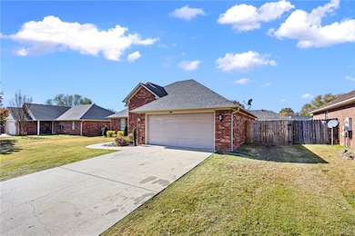 View of front of property with brick siding, concrete driveway, a shingled roof, and a garage