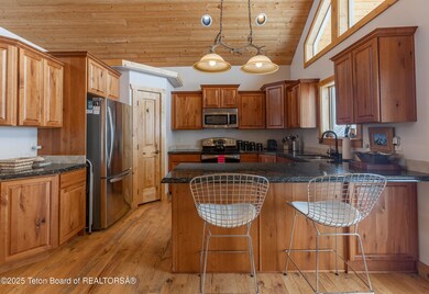 6 kitchen detail with pantry and stools