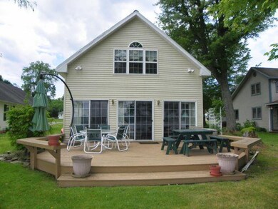 The sliders open up to the spacious, lakeside deck