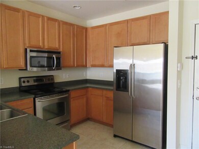 Kitchen with Stainless Steel Appliances. Recessed Lighting