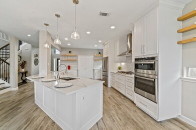 This spacious and bright kitchen is new to the home, installed in 2021.  With CUSTOM cabinets, NEW appliances, and abundance of storage options and prep areas, this kitchen truly is a DREAM!