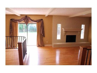 Living Room. Open living. Wood fireplace and oak f