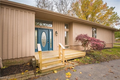 Doorway to property with a wooden deck