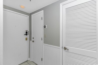 Doorway to outside with light tile patterned floors