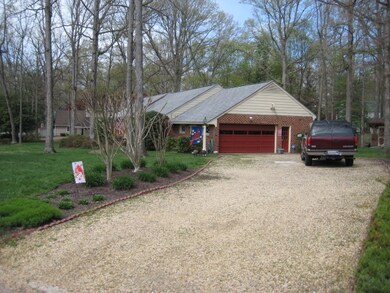 End view of home and driveway