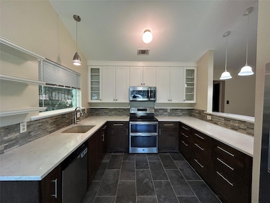 Kitchen featuring appliances with stainless steel